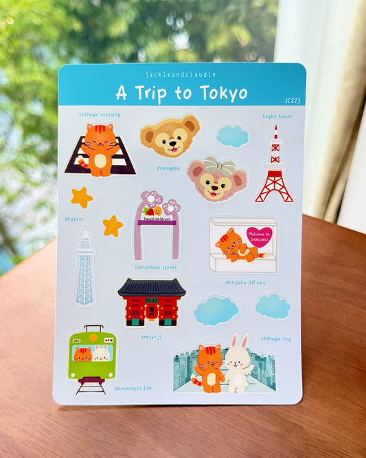 Pack of stickers titled 'A Trip to Tokyo' with various illustrations on a wooden surface.
