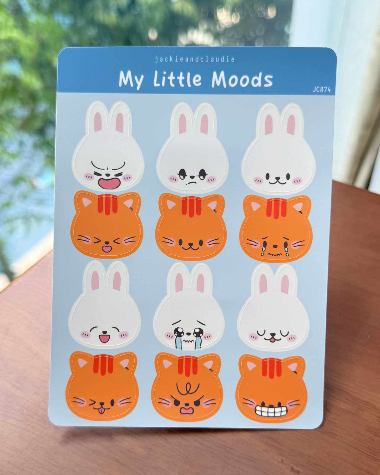 Pack of 'My Little Moods' stickers with cartoon cat and rabbit designs on a blue background.