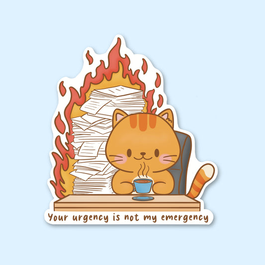 Sticker with a cat sitting at a desk with a cup, books on fire, and text 'Your urgency is not my emergency'